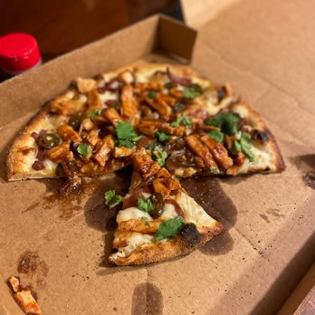 Full Circle Cafe - a half eaten pizza in a box - Pizza Near Me - Anderson, South Carolina