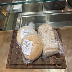 Italian rustic bread and sourdough. Custom cutting board from a vendor at the Palafox farmers market.