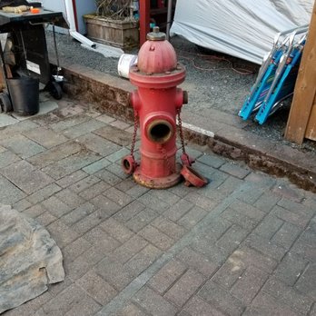 Greener Edge Landscape - a red fire hydrant - Landscaping Near Me