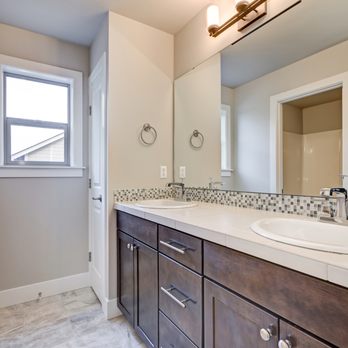 Vision Remodelers - a bathroom with a double sink - General Contractors Near Me - Chicago, Illinois