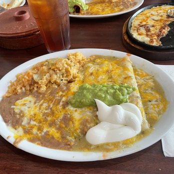 Mi Cocina - Enchiladas with Chile verde sauce beans n rice. - Mexican Near Me - Highland, California Mi Cocina - Enchiladas with Chile verde sauce beans n rice. - Mexican Near Me - Highland, California