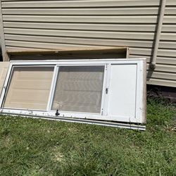 Lowe's Home Improvement - The old doors were just left laying against the house. I expected the installer to place them by the carport