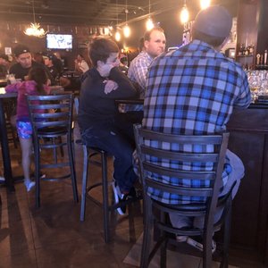 Photo of Slater's 50/50 - Anaheim Hills - Anaheim, CA, United States. Kids sitting at the bar