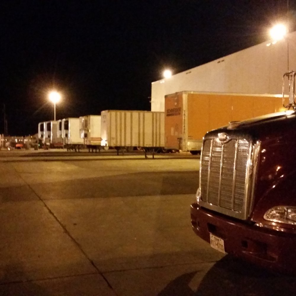 McLane - a semi truck parked in a parking lot at night - Grocery Near Me - Lubbock, Texas McLane - a semi truck parked in a parking lot at night - Grocery Near Me - Lubbock, Texas