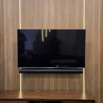 SetupTeam - Custom TV wall mounting with OLED TV and Sonos Arc soundbar by SetupTeam in a modern living room. - TV Mounting Near Me - Toronto, Ontario SetupTeam - Custom TV wall mounting with OLED TV and Sonos Arc soundbar by SetupTeam in a modern living room. - TV Mounting Near Me - Toronto, Ontario