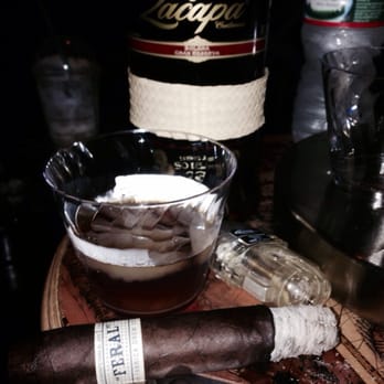 Cigar Vault Emporium - a cigar and a bottle of liquor - Tobacco Shops Near Me - New York, New York