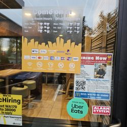 McDonald's - Hours of operations posted on door.