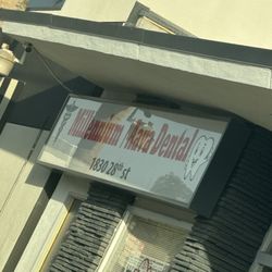 Millenium Dental Center - A sign