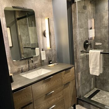 The Lloyd - Bathroom vanity and shower. There is a dim light feature that is nice, along with a nightlight. - Hotels Near Me - Stamford, Connecticut The Lloyd - Bathroom vanity and shower. There is a dim light feature that is nice, along with a nightlight. - Hotels Near Me - Stamford, Connecticut
