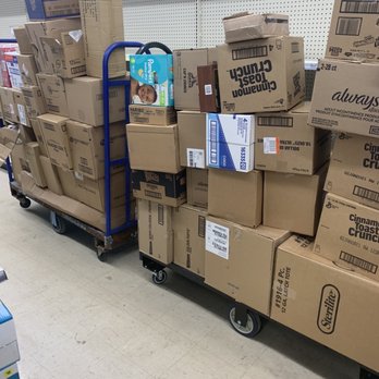 Dollar General - a cart full of boxes in a store - Grocery Near Me - Wanamaker, Indiana