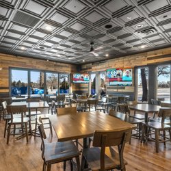 On Par Restaurant & Lounge - Dining area with cozy booths and table options for multiple party sizes!