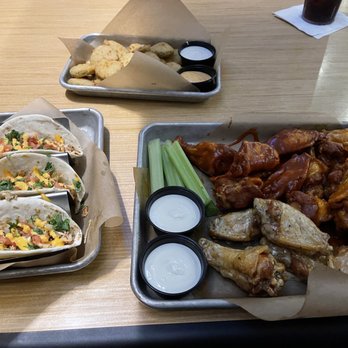Buffalo Wild Wings - a tray of buffalo wings and a tray of corn and celery - Chicken Wings Near Me - St Augustine, Florida