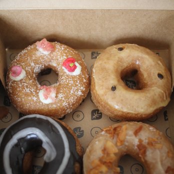Holey Grail Donuts - Tasting Box $15 - TL - L&L lemon & lime TR - Lilikoi BL - Chocolate Haupia BR - Reincarnated - Maple & coconut - Donuts Near Me - Honolulu, Hawaii Holey Grail Donuts - Tasting Box $15 - TL - L&L lemon & lime TR - Lilikoi BL - Chocolate Haupia BR - Reincarnated - Maple & coconut - Donuts Near Me - Honolulu, Hawaii