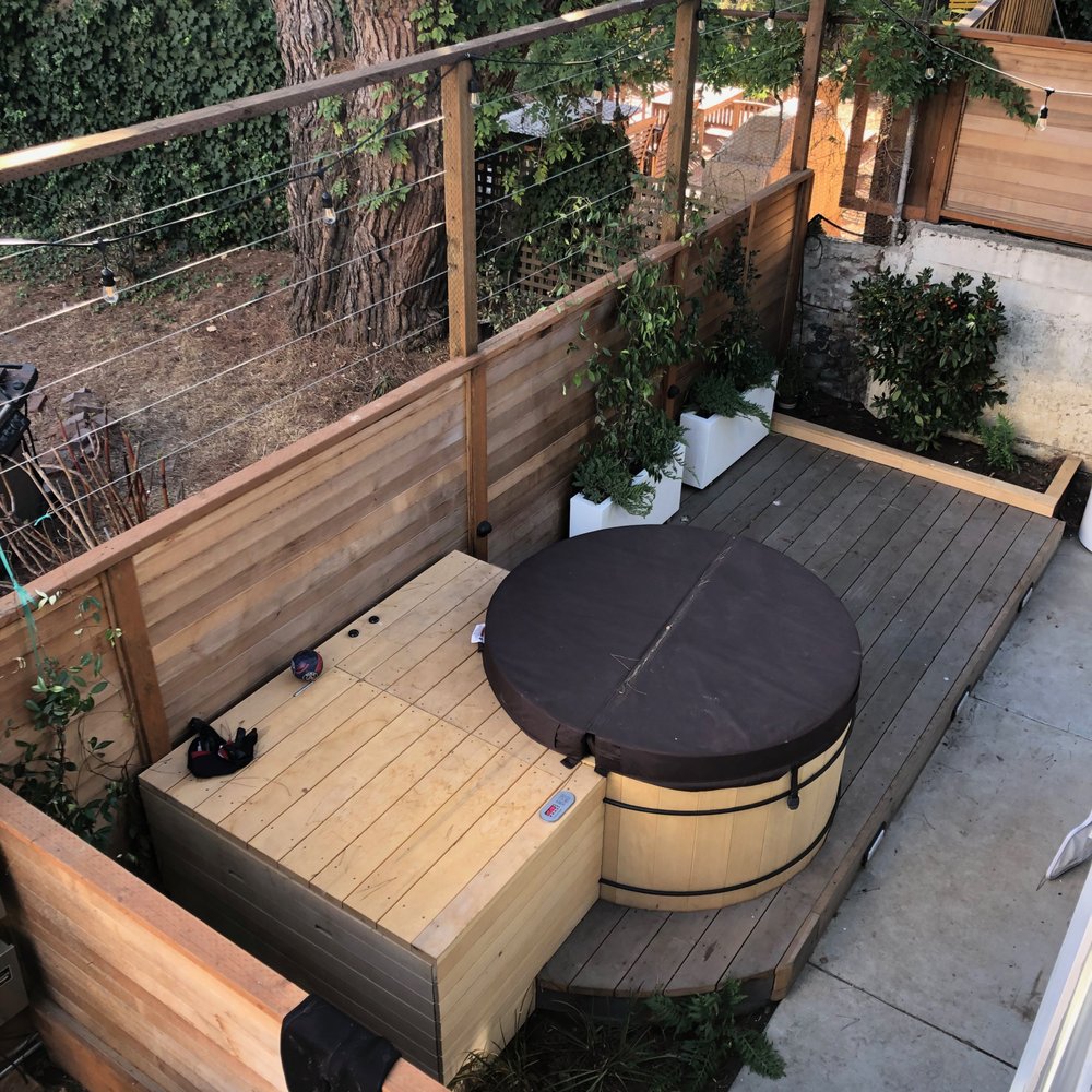 Hot tub with deck and privacy fending (lights added later) Hot tub with deck and privacy fending (lights added later)