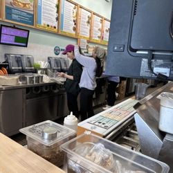 Food prep area. Girls are making customers orders and co workers are doing their hair