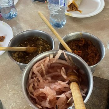 Coox Hanal - Pickled red onions on the large bowl, the i 2 bowls have chillies that are seasoned with different spices. - Yucatan Near Me - México, D.F., DIF