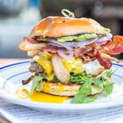 Duke's Grocery - The Proper Burger - fully loaded with Applewood Smoked Bacon, Smashed Avocado and Runny Egg!