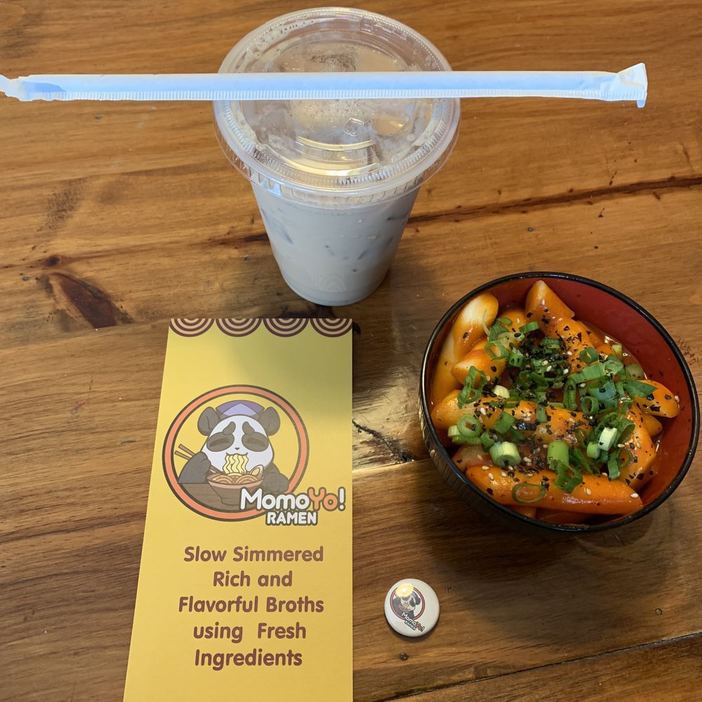 Momoyo Ramen - Front of menu, free button, tteok-bokki rice cake bowl and thai tea - Ramen Near Me - Hampton, New Hampshire