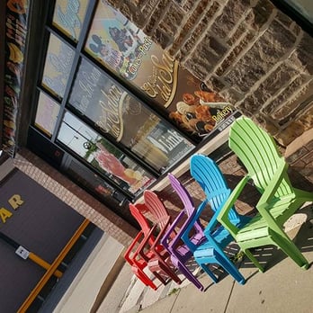 El Rincon Del Sabor - a row of colorful chairs - Coffee & Tea Near Me - Chicago, Illinois