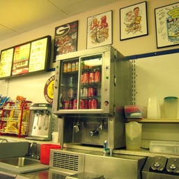 The milk machine,cold soft drinks, and a partial menu.