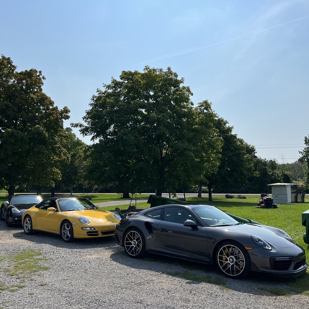 Long Cliff Vineyard & Winery - two sports cars parked in a parking lot - Wine Tours Near Me - Sanborn, New York Long Cliff Vineyard & Winery - two sports cars parked in a parking lot - Wine Tours Near Me - Sanborn, New York