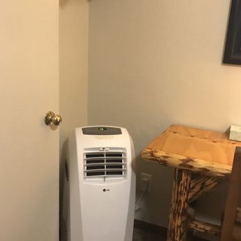 Evergreen Motel - Air conditioning unit and closet. - Hotels Near Me - West Yellowstone, Montana