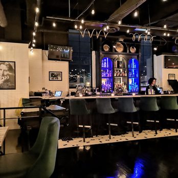 Black Sheep - a bar with chairs and a bar counter - Cocktail Bars Near Me - Toronto, Ontario