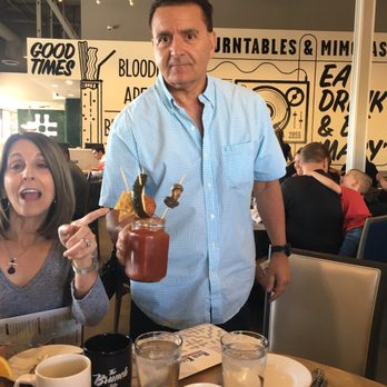 Hash Kitchen - Dad with his Bloody Mary complete with meatball and fried ravioli - Breakfast & Brunch Near Me - Chandler, Arizona Hash Kitchen - Dad with his Bloody Mary complete with meatball and fried ravioli - Breakfast & Brunch Near Me - Chandler, Arizona