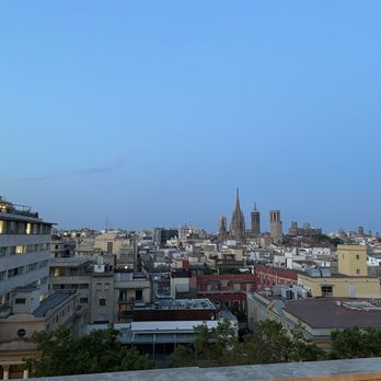 Hotel 1898 - This area is apart from the pool but there's tables to eat, drink, and enjoy views - Hotels Near Me - Barcelona, B