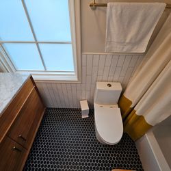 Hammer Stars - Updated Bathroom with custom cabinets and modern flooring