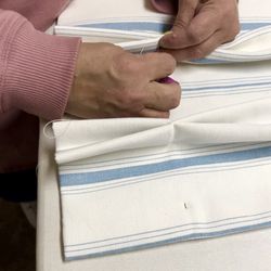 Draped In Style - Our team creates hand sewn, pleated draperies to ensure a truly custom finish!