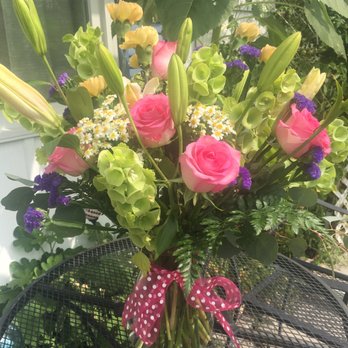 Bloom and Bean - a vase of flowers on a table - Florists Near Me - Great Falls, Montana