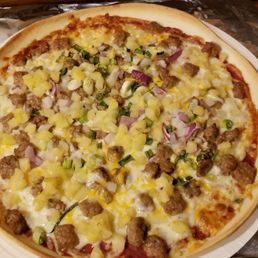 a pizza with sausage, cheese, and onions