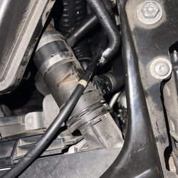 Domar Automotive - The part that was broke off by the Dormar driver causing the coolant to leak out.