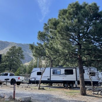 Flagstaff KOA - Large pull through sites. Boulders at the ends to give separation between sites make obstacles for large rigs. - RV Parks Near Me - Flagstaff, Arizona
