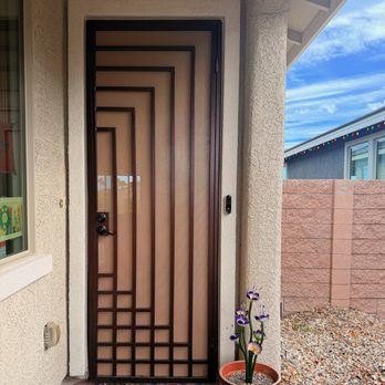 Artistic Iron Works - Security Door and Artistic Ironwork Flower in Pot by Door - Fences & Gates Near Me - Las Vegas, Nevada