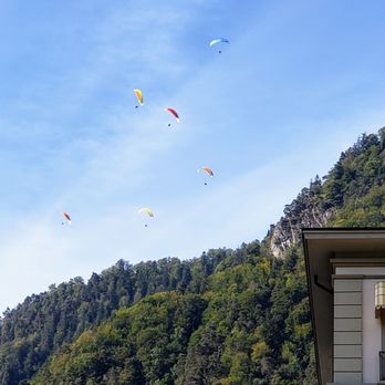 Skywings Adventures - View of Paragliders over Interlaken - Rafting/Kayaking Near Me - Ringgenberg Be, BE Skywings Adventures - View of Paragliders over Interlaken - Rafting/Kayaking Near Me - Ringgenberg Be, BE