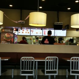 a man ordering food at the counter a man ordering food at the counter