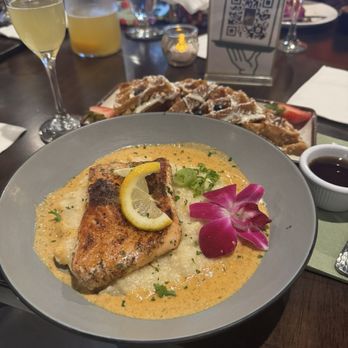 Ibis Cuisine - Salmon and grits with sweet potato waffles - Caribbean Near Me - Virginia Beach, Virginia