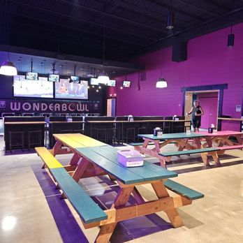 The Hub Trampoline & Axe Throwing - Wide view of The Patio indoor area with seating and games. - Recreation Centers Near Me - Council Bluffs, Iowa The Hub Trampoline & Axe Throwing - Wide view of The Patio indoor area with seating and games. - Recreation Centers Near Me - Council Bluffs, Iowa