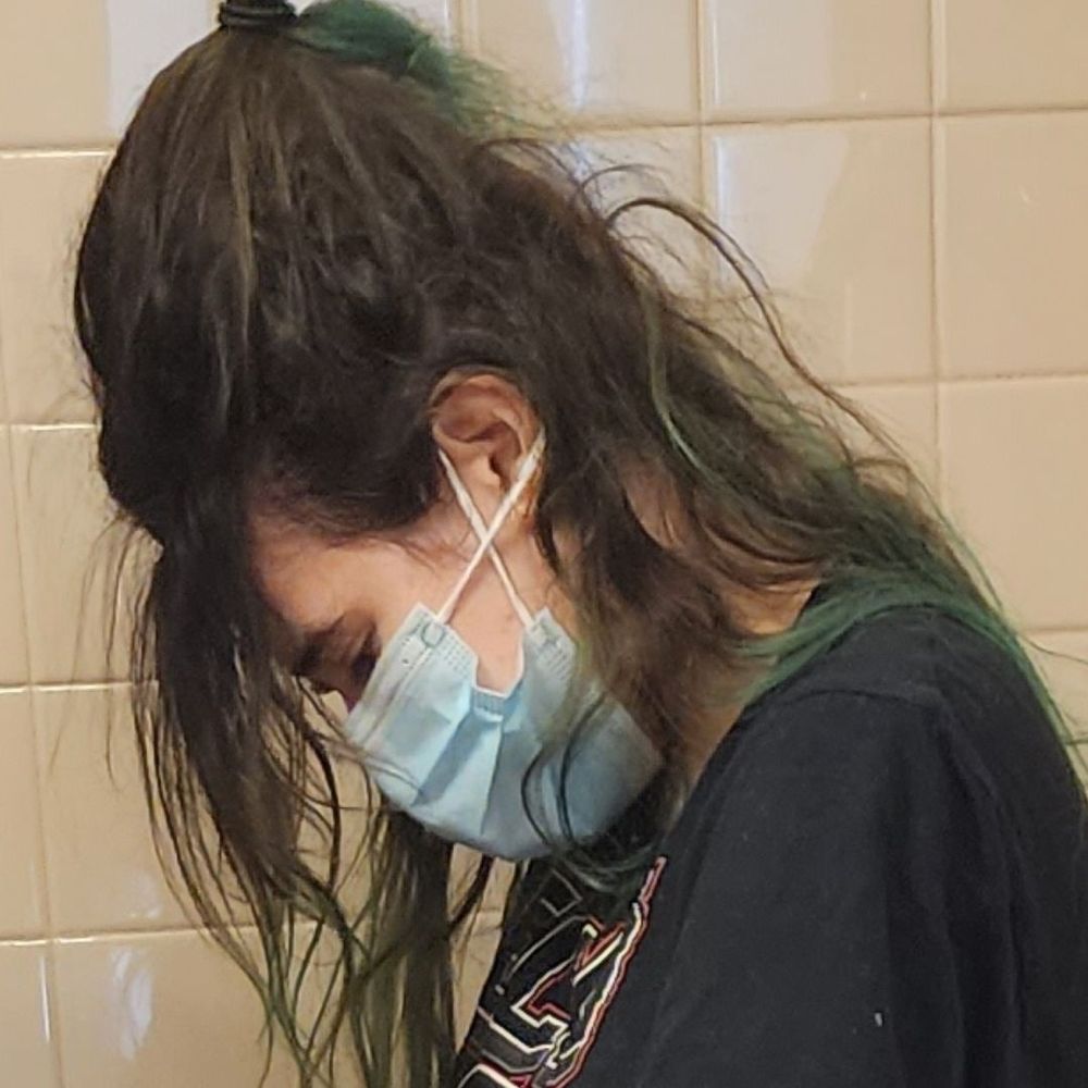 Her hair was so badly snarled that it was in a ball that protruded about four inches from the crown of her head. Her hair was so badly snarled that it was in a ball that protruded about four inches from the crown of her head.