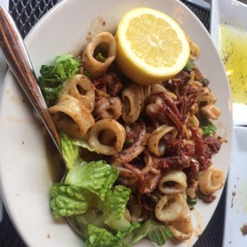 Stella's - Calamari with sun-dried tomatoes and artichokes - Greek Near Me - Charleston, South Carolina