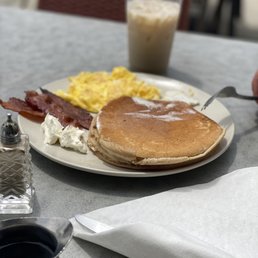 Chai pancakes with scrambled eggs and bacon, with an iced chai. Chai pancakes with scrambled eggs and bacon, with an iced chai.