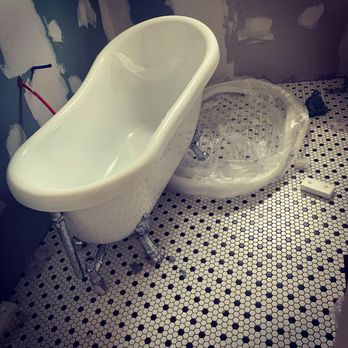 Chairman Remodeling Group - A clawfoot tub install with classic hexagon tile in the galleria area . - General Contractors Near Me Chairman Remodeling Group - A clawfoot tub install with classic hexagon tile in the galleria area . - General Contractors Near Me