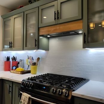 1st Avenue Fix Ups - Backsplash and range hood install, replacing the microwave. Unit is inside the cabinet, stained wood facade added. - Painters Near Me