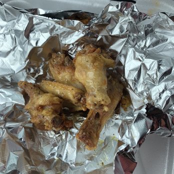 The Wing Place - chicken wings wrapped in tin foil - Chicken Wings Near Me - Columbus, Georgia