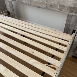 Ashley Store + Outlet - Bent & uneven wood panels under bed