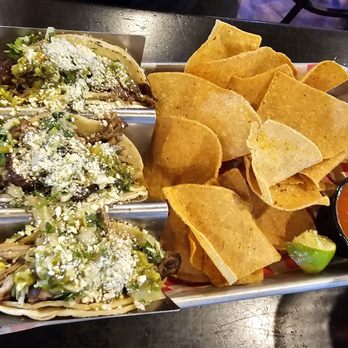 Alpha Charlie's Tap & Tavern - Tacos! Carnitas, I think......  the chips have a taste of lime and are really good too. - Sports Bars Near Me - Centennial, Colorado