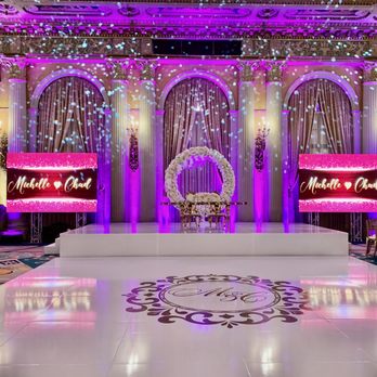 Rhythmic Entertainment - Setup complete: Custom dance floor with monogram sticker, 2 TV monitors and uplighting. - DJs Near Me Rhythmic Entertainment - Setup complete: Custom dance floor with monogram sticker, 2 TV monitors and uplighting. - DJs Near Me