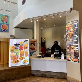Purple Kow - a man standing behind a counter in a restaurant - Desserts Near Me - Berkeley, California Purple Kow - a man standing behind a counter in a restaurant - Desserts Near Me - Berkeley, California